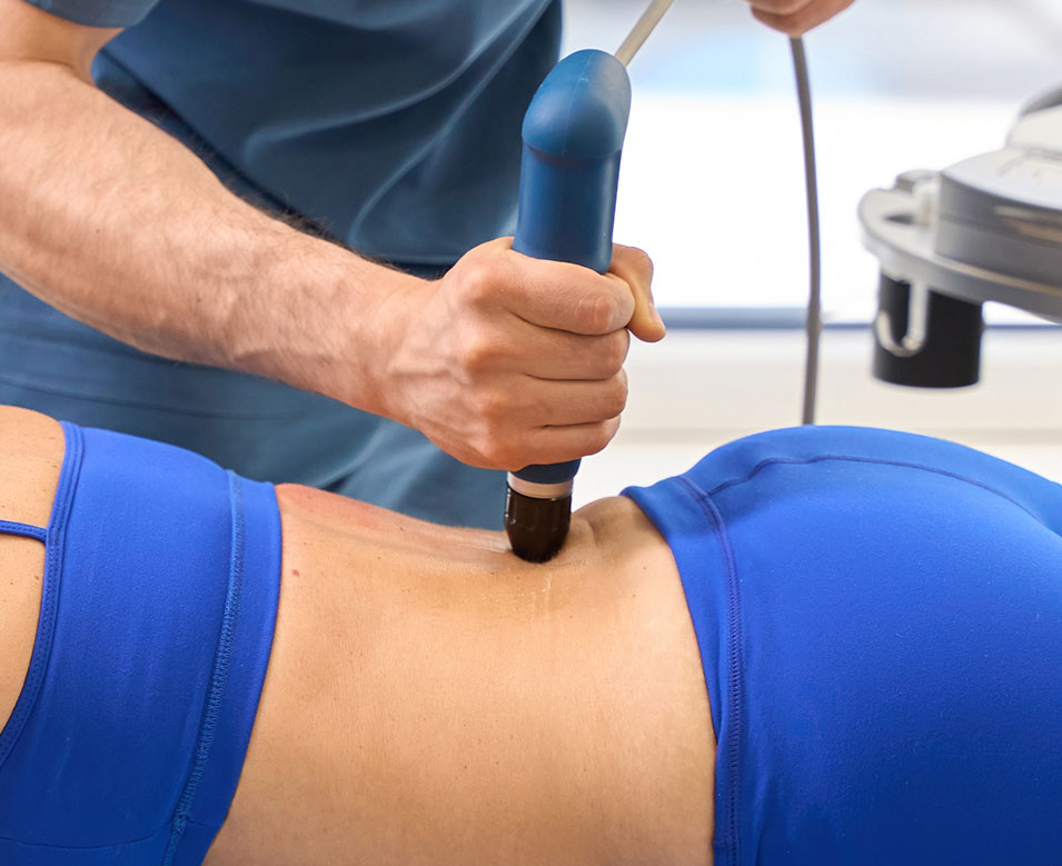 Female patient being treated with Shockwave Therapy